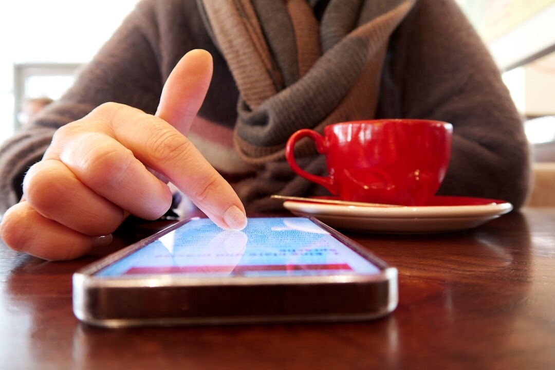 person scrolling phone for series recommendations