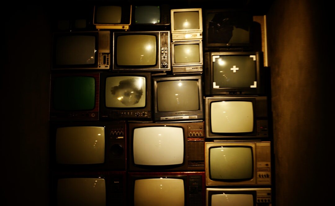 Close-up of television screens showing broadcast news content
