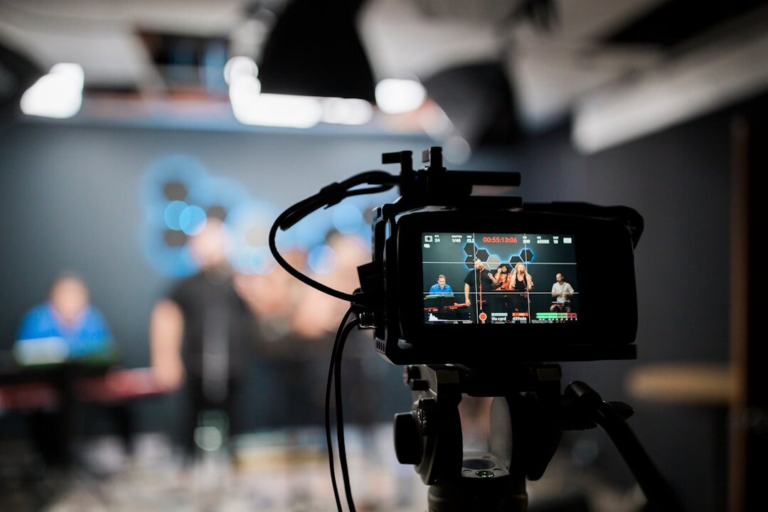 Modern TV broadcasting studio with professional cameras and screens
