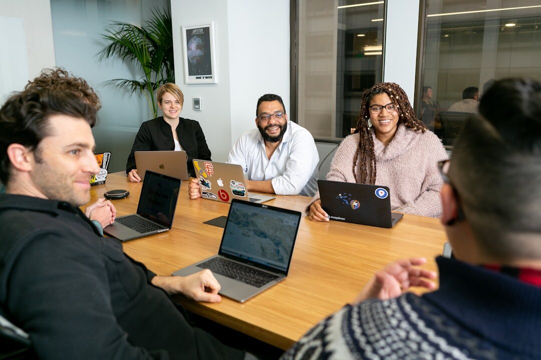 Diverse team of media professionals collaborating around a table